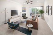 Living room with fireplace and private balcony at Camden Silo Creek apartments in Ashburn, VA