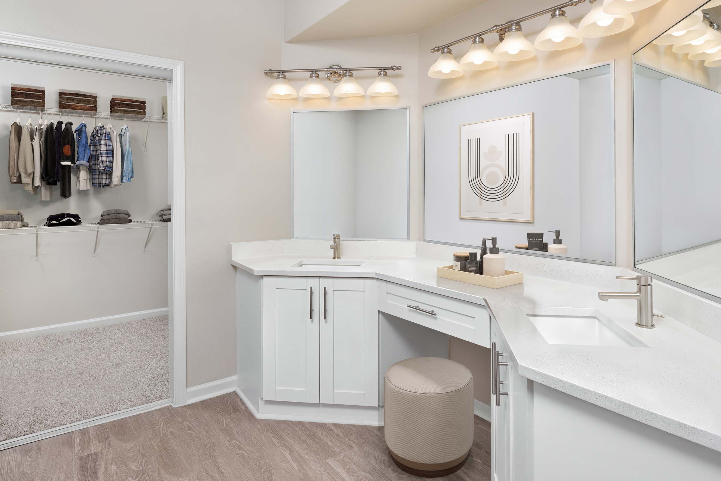 Modern style bathroom with double vanity sinks and walk in closet at Camden Phipps apartments in Atlanta, GA