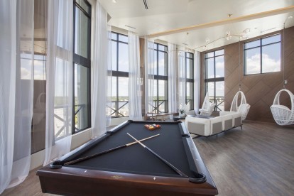 Sky lounge with pool table at Camden North Quarter apartments in Orlando, FL