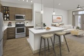 Kitchen with breakfast bar and stainless steel appliances at Camden Lincoln Station in Lone Tree, CO