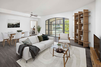 Spacious living room with a ceiling fan, recessed lighting, and hardwood-style floors at Camden Potomac Yard Apartments in Arlington, VA