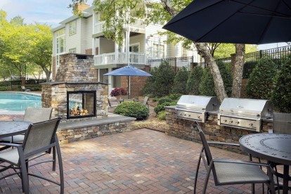 Enjoy outdoor dining and grilling by the pool at Camden Lake Pine in Apex, NC