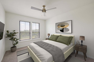Bedroom with a lighted ceiling fan at Camden Heights apartments in Houston, TX