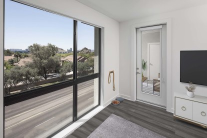 Camden Tempe West Apartments Tempe Arizona contemporary living area with floor-to-ceiling window near patio 