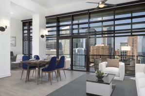 Penthouse with spacious living area and dining room with downtown and toyota center views