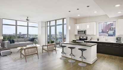 Kitchen with quartz countertops and large kitchen islands and skyline views