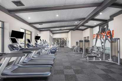 24-Hour fitness center with cardio and strength training machines 