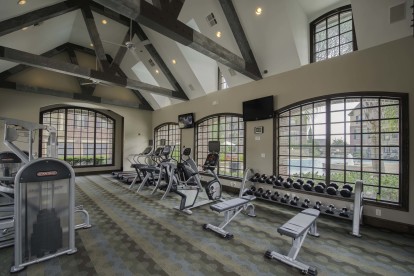 24-hour Fitness Center featuring strength training and cardio equipment 