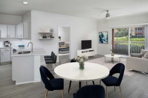 Open concept kitchen and living room with patio