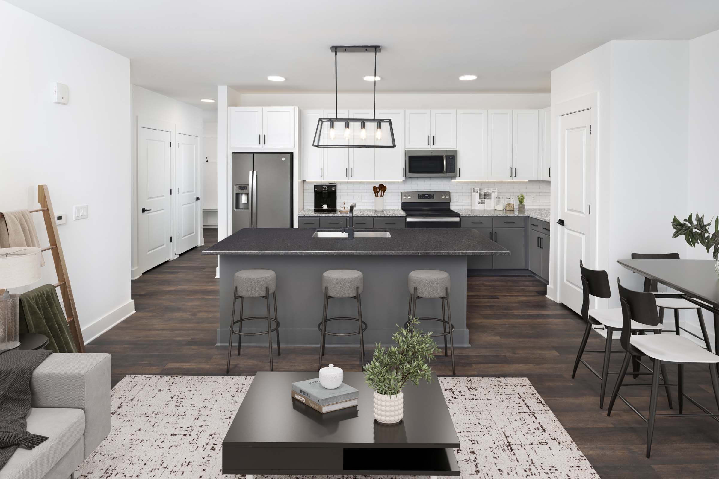 Living room and kitchen with wood-style flooring at Camden West Nashville apartments in Nashville, TN