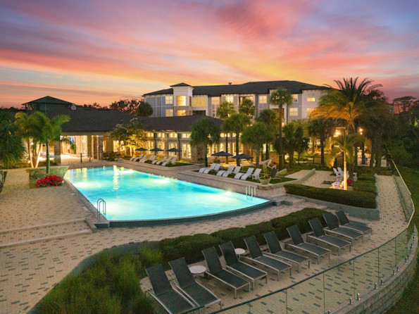 Community pool at dusk at Camden Lake Buena Vista apartments in Orlando, FL