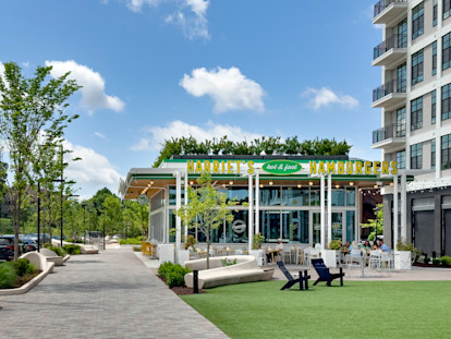 Harriet's Hamburgers restaurant and outdoor lawn at Ballantyne Bowl near Camden communities in Ballantyne, NC