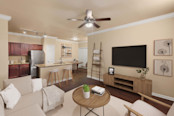 First-floor living room with wood-style floors at Camden Brushy Creek apartments in Cedar Park, TX