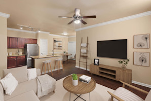 First-floor living room with wood-style floors at Camden Brushy Creek apartments in Cedar Park, TX