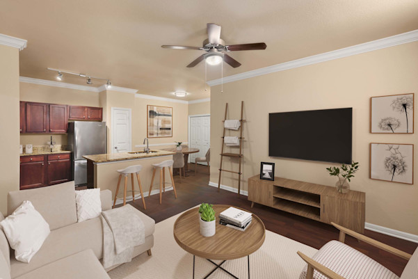 First-floor living room with wood-style floors at Camden Brushy Creek apartments in Cedar Park, TX