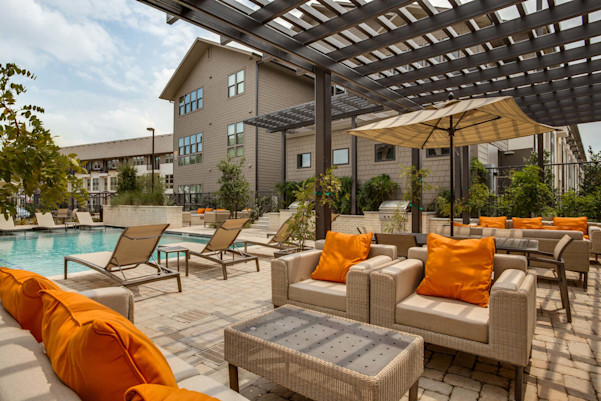 Villas side pool and poolside lounge seating under cabanas