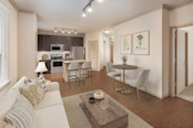 Open-concept living room and kitchen with dining area at Camden La Frontera
