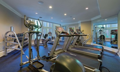 24 hour fitness center with cardio and strength training equipment