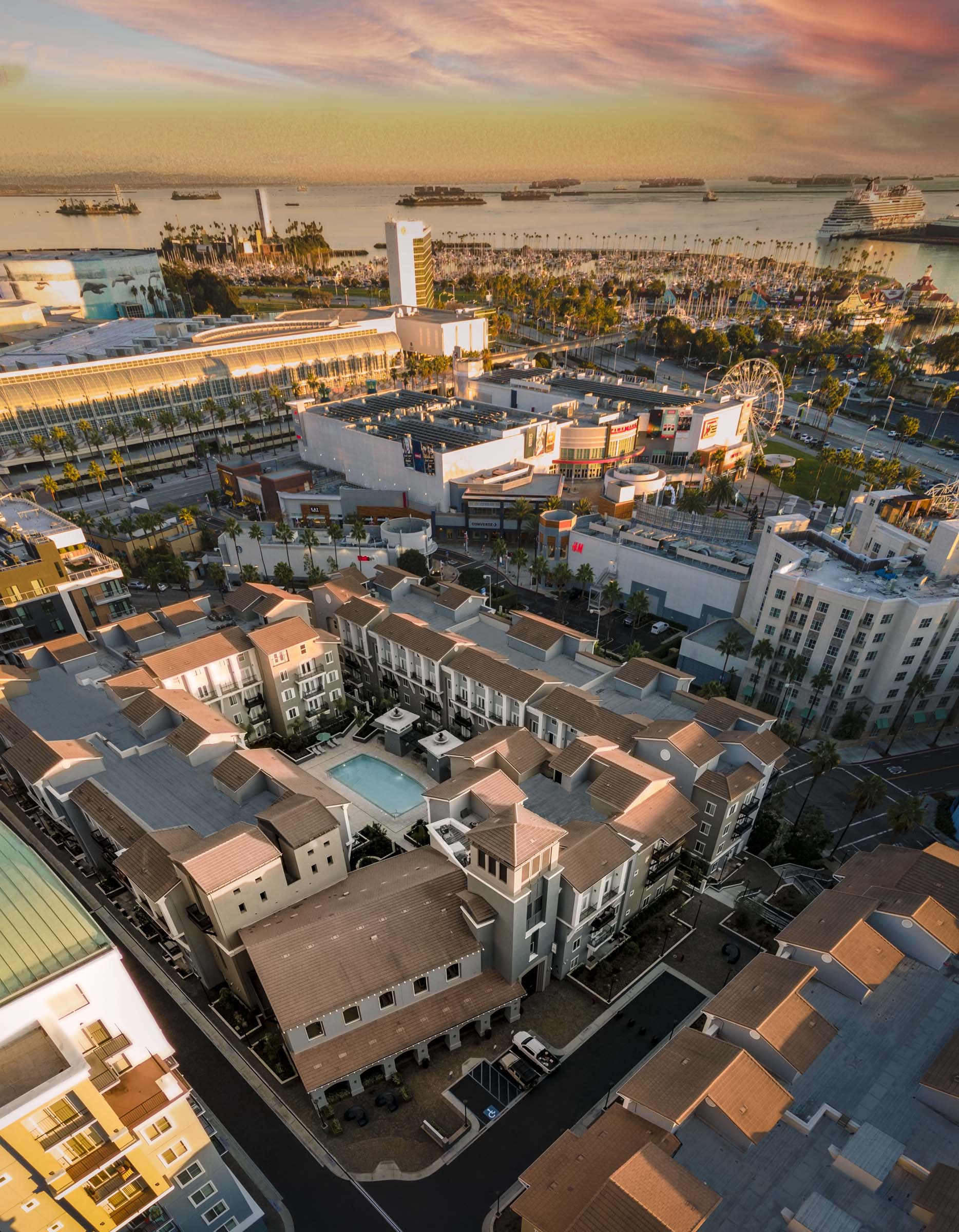 Aerial view of Camden Harbor View Apartments near ocean and the Queen Mary