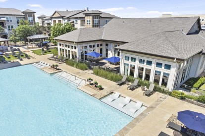 Aerial view of resort-style pool and clubhouse at Camden La Frontera apartments in Round Rock, TX