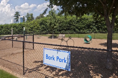 Onsite fenced dog park with agility equipment