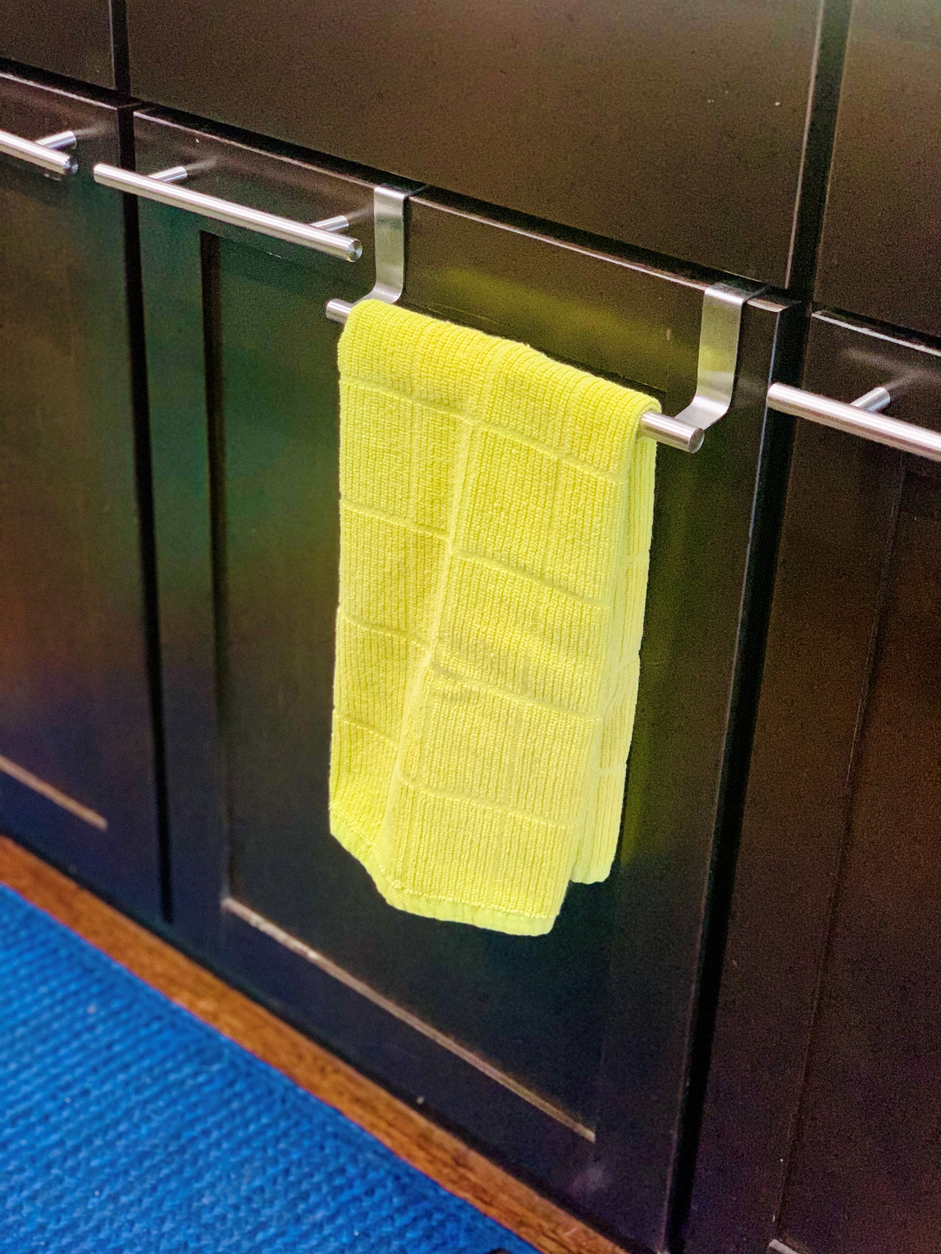 Over-the-door cabinet towel bar