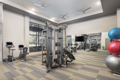 24-hour fitness center with a motion cage functional training machine at Camden Victory Park
