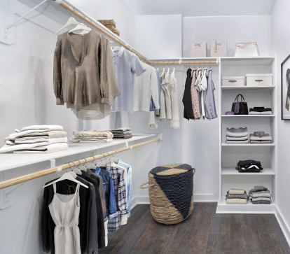 Closet with built-in wood shelving and storage at Camden NoDa in Charlotte North Carolina