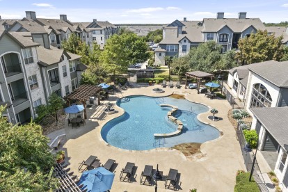 Aerial view of resort-style pool and sundeck at Camden Amber Oaks apartments in Austin, TX