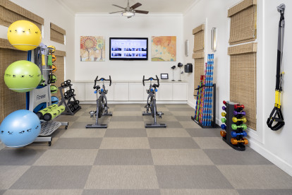 Yoga studio with spin bikes and interactive fitness at Camden LaVina apartments in Orlando, Florida.