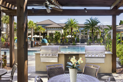 Poolside BBQ Grills at Camden Westchase Park Apartments in Tampa, Florida.