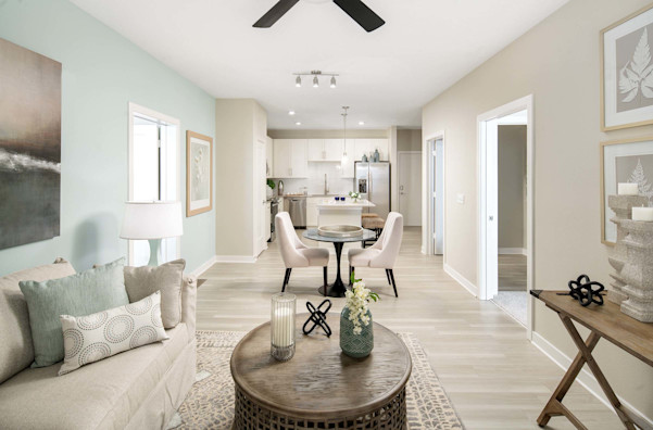 Open-concept living, dining, and kitchen at Camden Clearwater apartments in Clearwater. FL