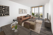 Open-concept living and dining area at Camden Potomac Yard apartments in Arlington, VA