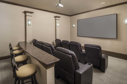 Community movie theater room with tiered seating at Camden Brushy Creek apartments in Austin, TX