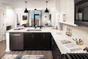 Kitchen and living room with balcony at Camden Gulch apartments in Nashville, TN