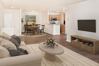 Open-concept living and dining with hardwood-style flooring at Camden Touchstone in Charlotte, NC