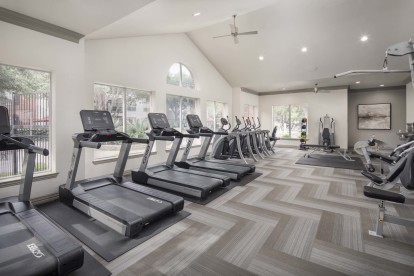 24-hour fitness center with cardio machines at Camden Buckingham apartments in Richardson, TX