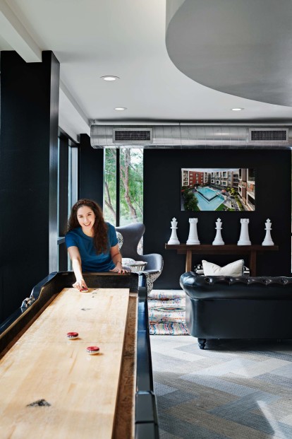 Resident lounge with shuffleboard and televisions