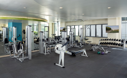 24-Hour Fitness Center with Free Weights and Row Machine