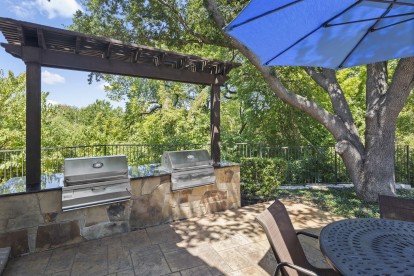 Poolside grills at Camden Legacy Creek apartments in Plano, TX