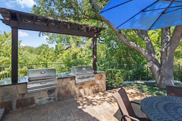 Poolside grills at Camden Legacy Creek apartments in Plano, TX
