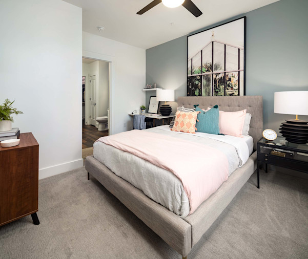 Bedroom with carpet, ceiling fan, and ensuite bathroom at Camden West Nashville apartments in Nashville, TN