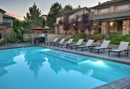 Resort style swimming pool with outdoor lounge  at Camden Denver West Apartments in Golden, CO