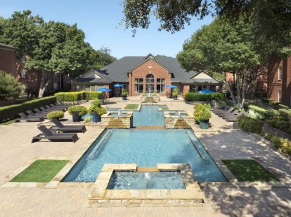 Aerial view of resort-style pool and sundeck at Camden Addison apartments in Addison, TX