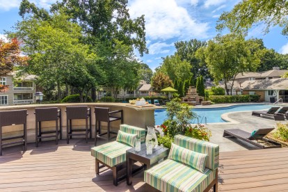 Deck area with seating next to saltwater pool at Camden Fairview in Charlotte North Carolina