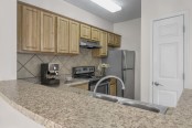 Camden Peachtree City apartments in Peachtree City, GA kitchen with stainless steel appliances