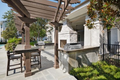 Outdoor grills with dining area at Camden Northpointe Apartments in Tomball, TX