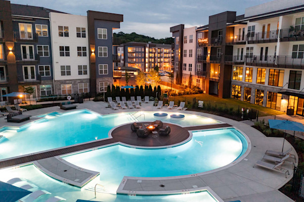 Aerial view of resort-style pool at twilight at Camden West Nashville apartments in Nashville, TN