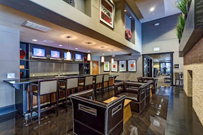 Resident lounge with kitchenette and dining and barstool seating