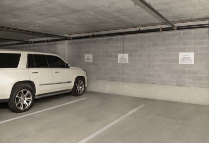 Reserved parking spaces in the garage at Camden Music Row apartments in Nashville, TN